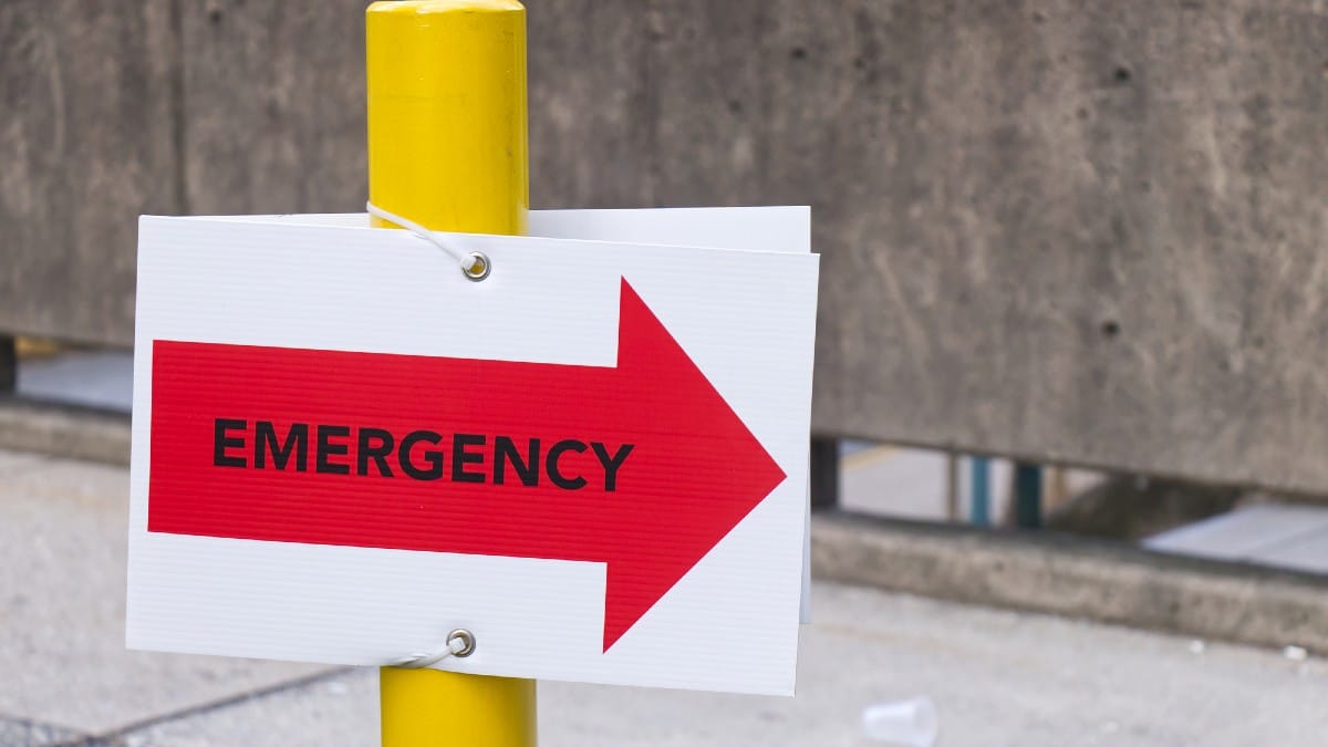 Close up view of Hospital emergency sign in red with directional