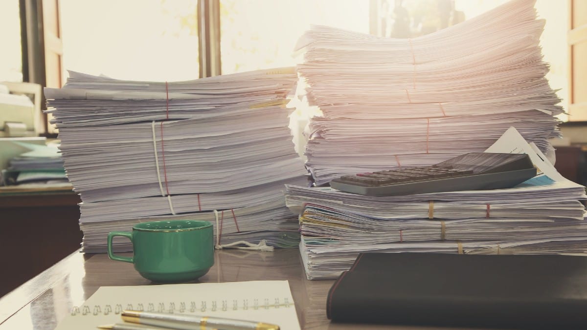 Remove BG Save Share Sample Pile of unfinished documents on office desk, Stack of business paper
