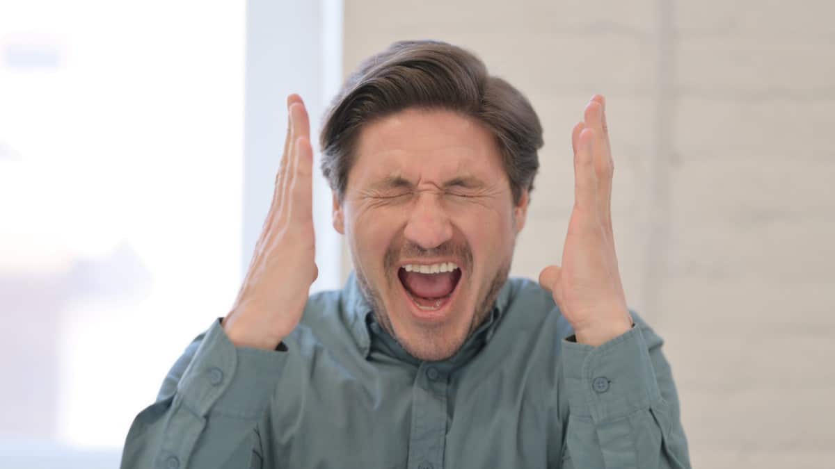 Portrait of Attractive Middle Aged Man Screaming, Shouting