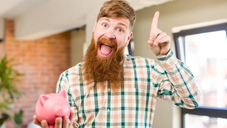 Red hair man feeling like a happy and excited genius after realizing