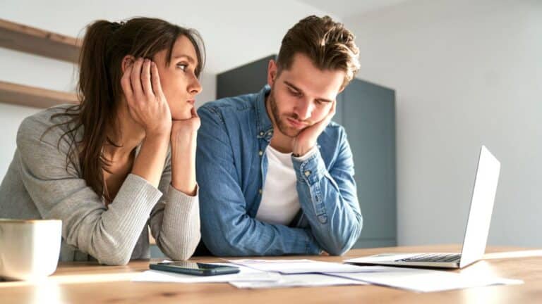 couple staring at bills
