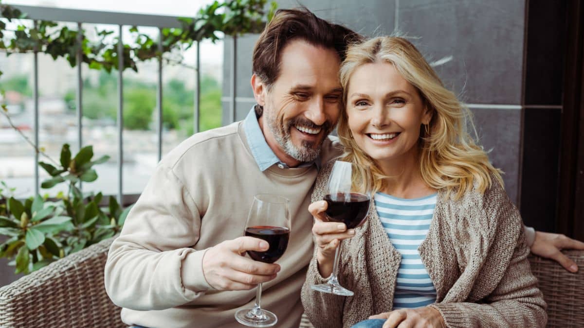 elder couple drinking wine