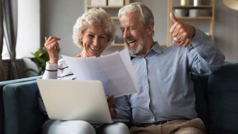 elder couple reviewing documents