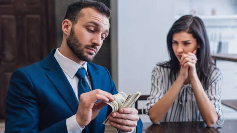 man counting money
