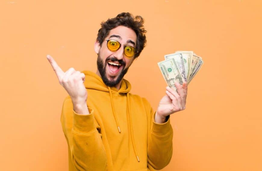 man with glasses holding money