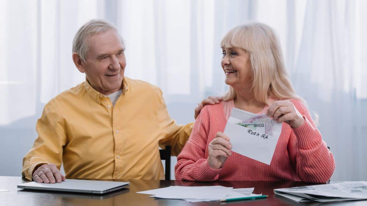 senior couple with envelopes