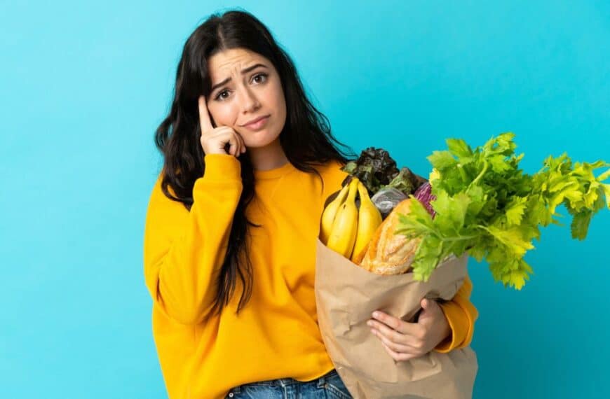woman confused with groceries
