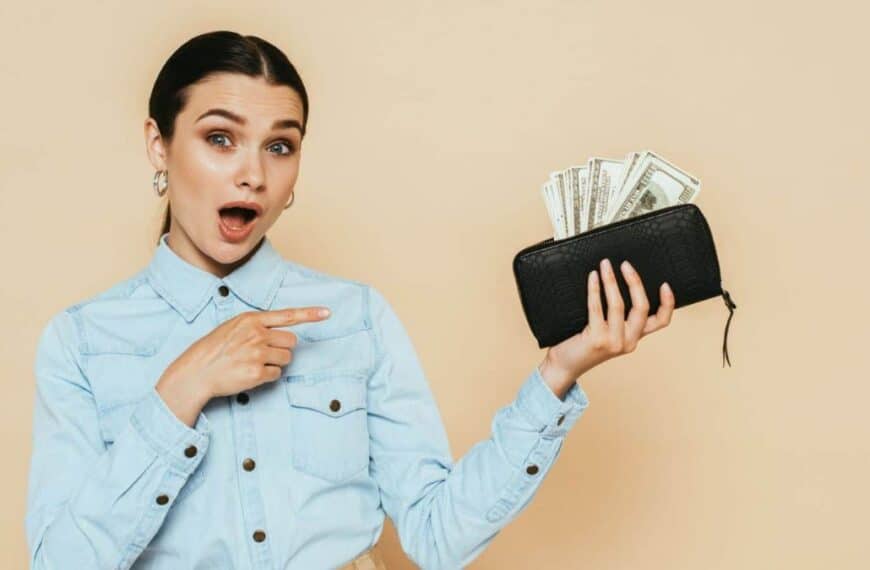 woman holding a purse with cash