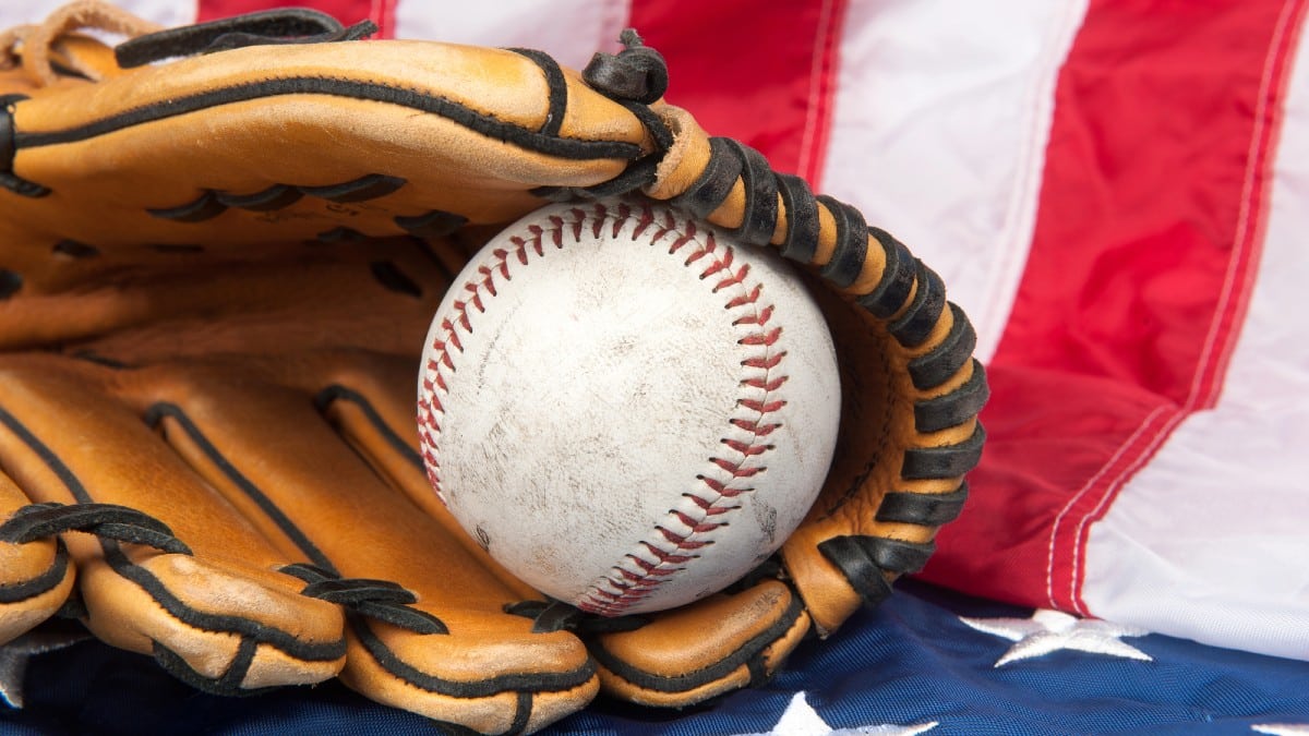 Baseball and glove on American flag