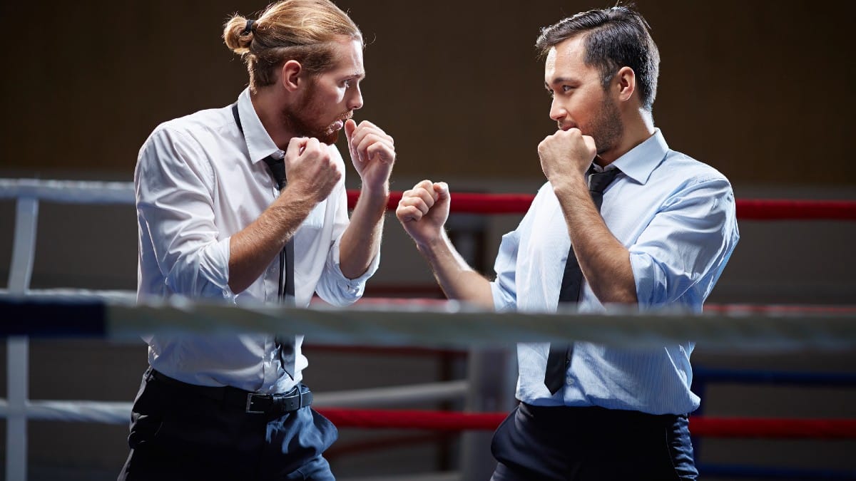 Businessmen fighting on boxing ring