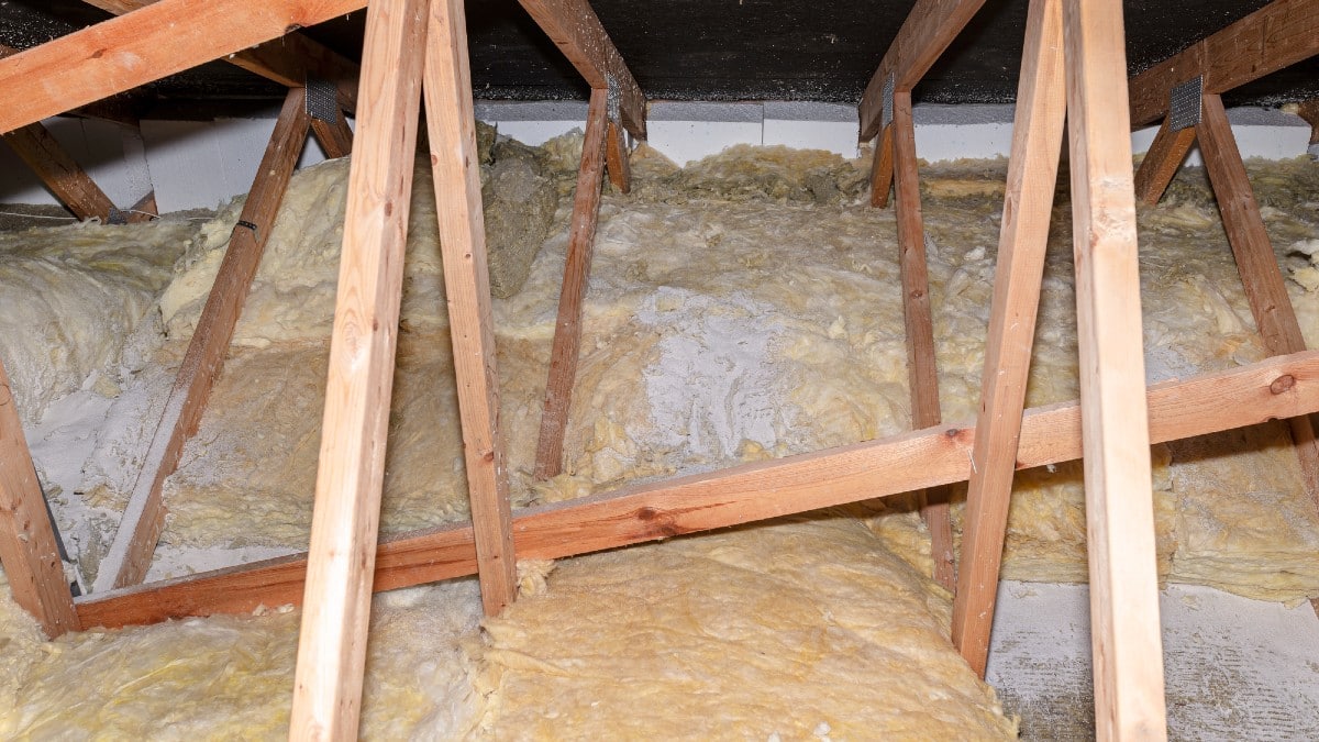Glass wool placed on pipes in domestic ventilation