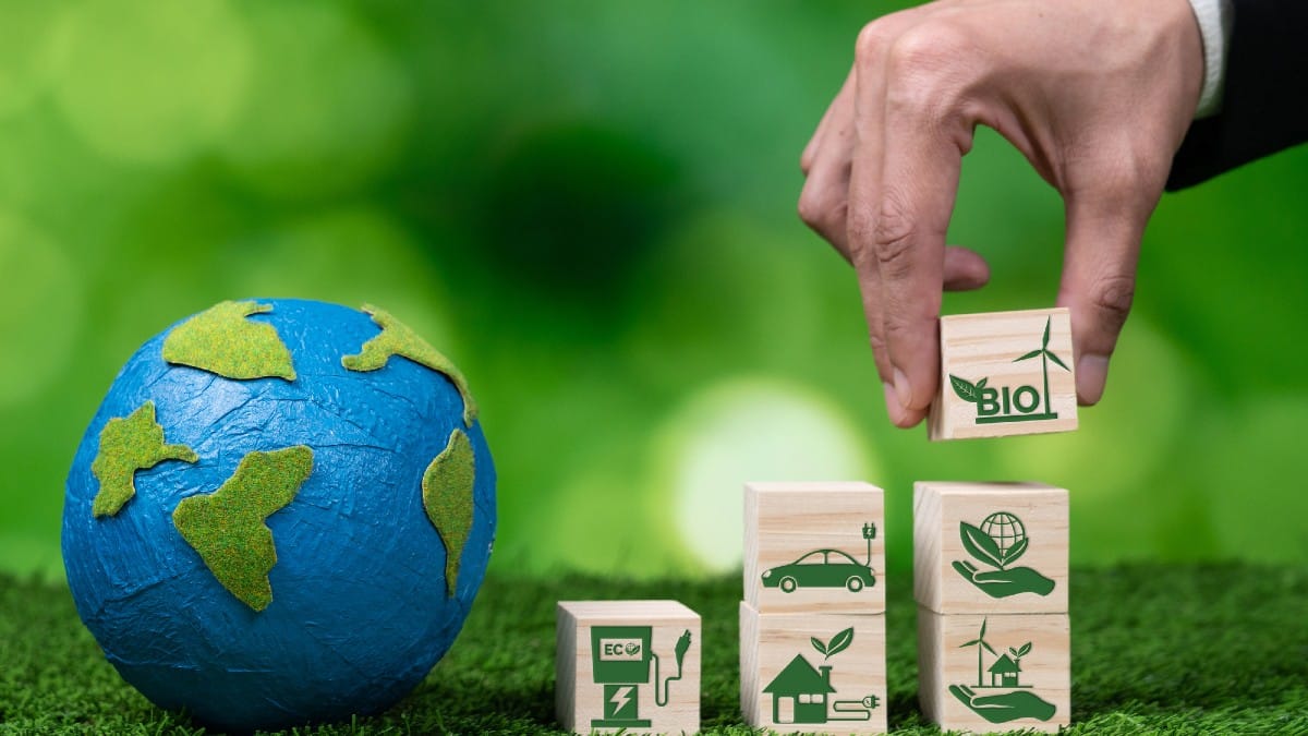 Hand of businessman holding Earth, symbolizing green business