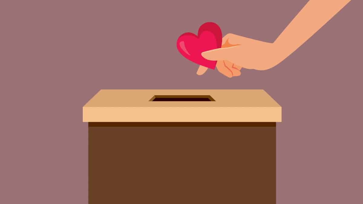 Person Inserting a Heart in a Donation Box Vector Concept Illustration