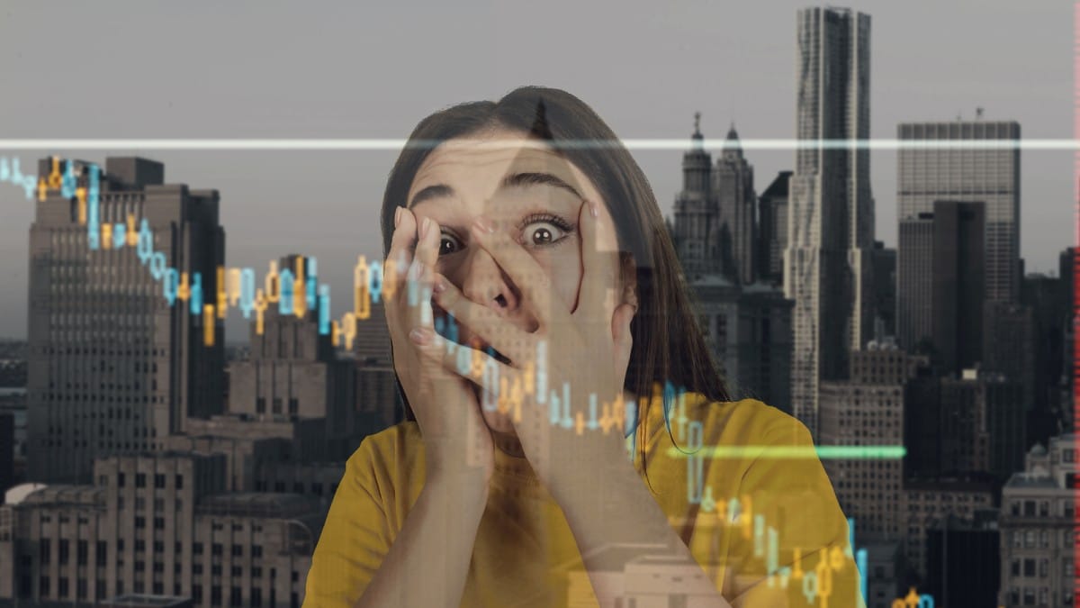 Stressed woman holding head with hands on abstract city background.