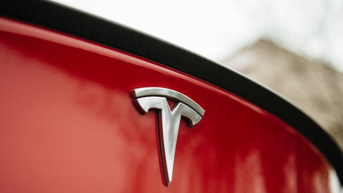 Tesla Motors logo on a red car.