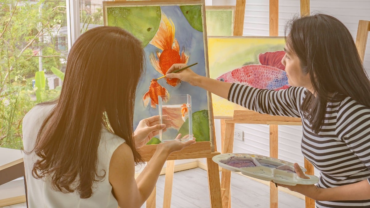 Two young asian woman artist dawning while useing ideas