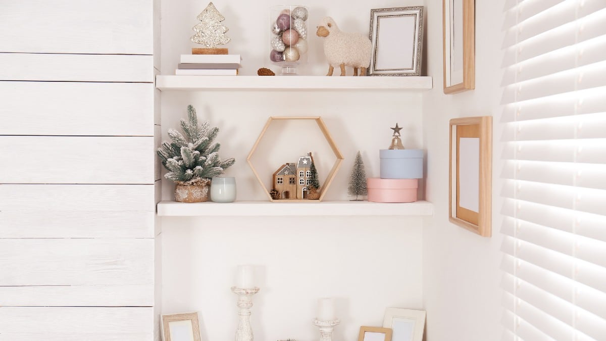 Wall shelves with beautiful Christmas decor indoors.