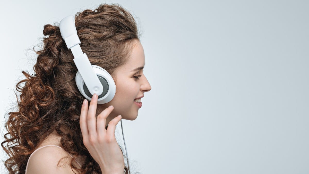Woman listening music in headphones