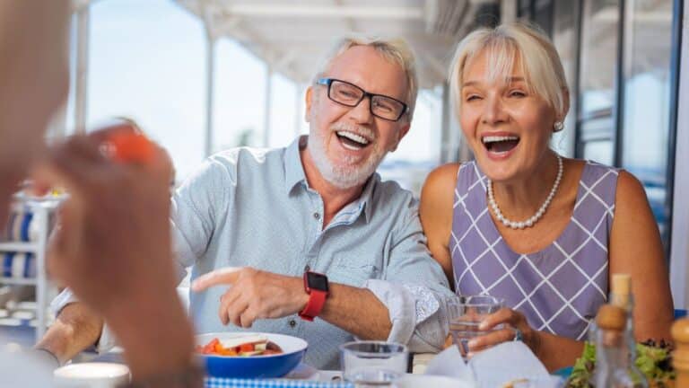 elder couple laughing