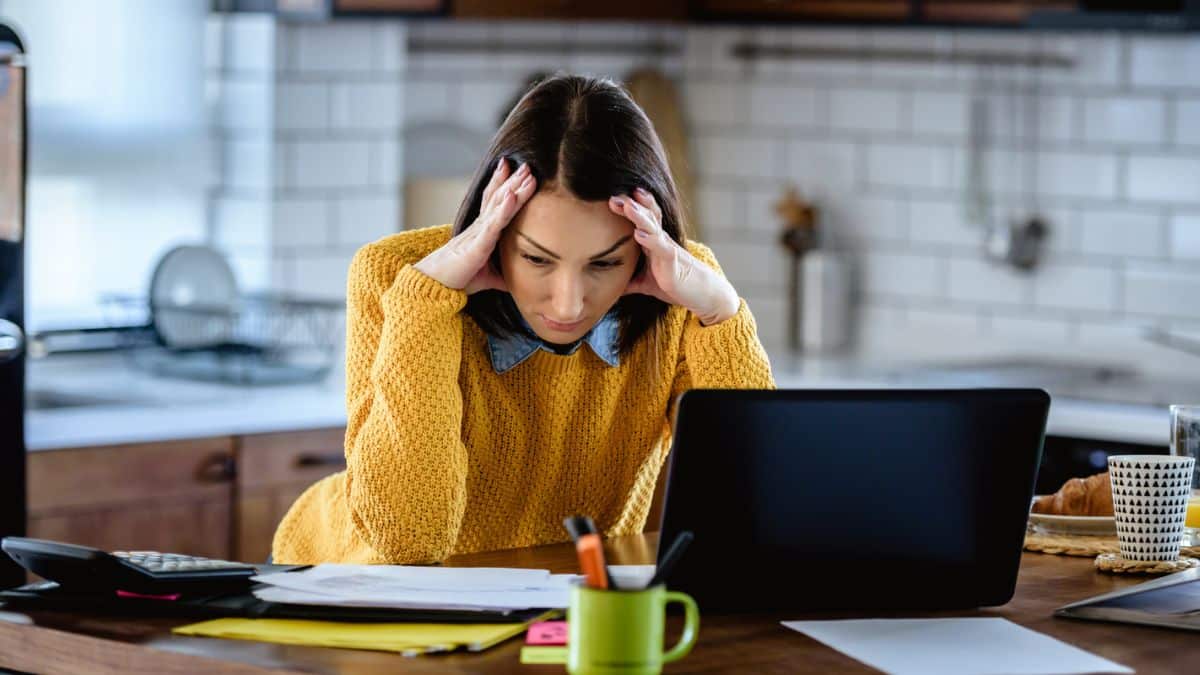 woman stressed on her desk