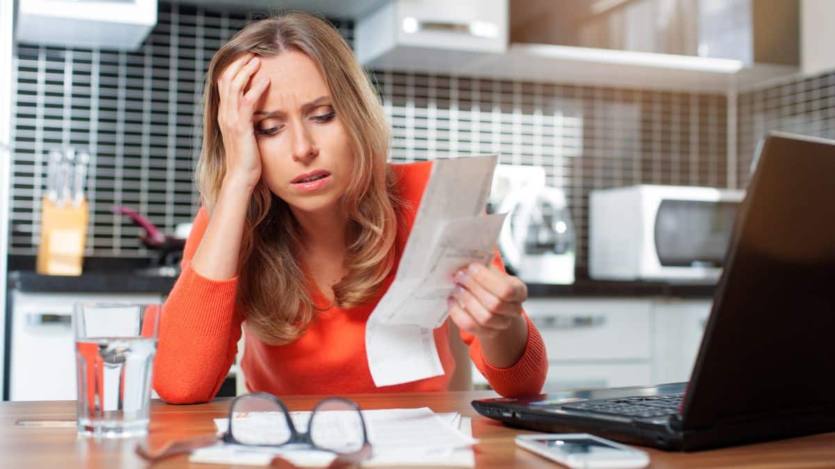 woman stressed over bills and expenses