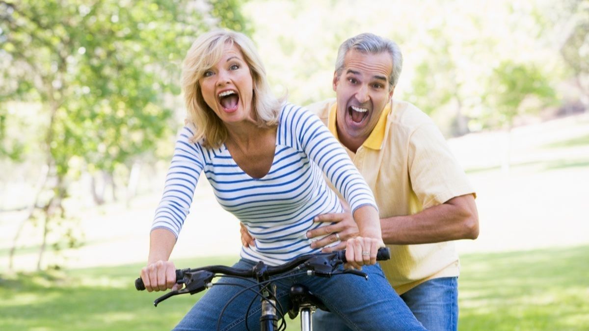 couple boomers riding a bike