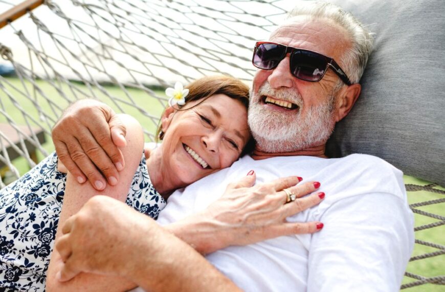 elder couple sitting on hammock