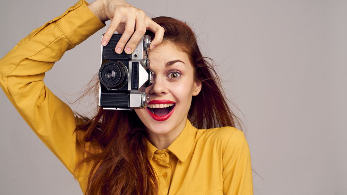 woman smiling with camera