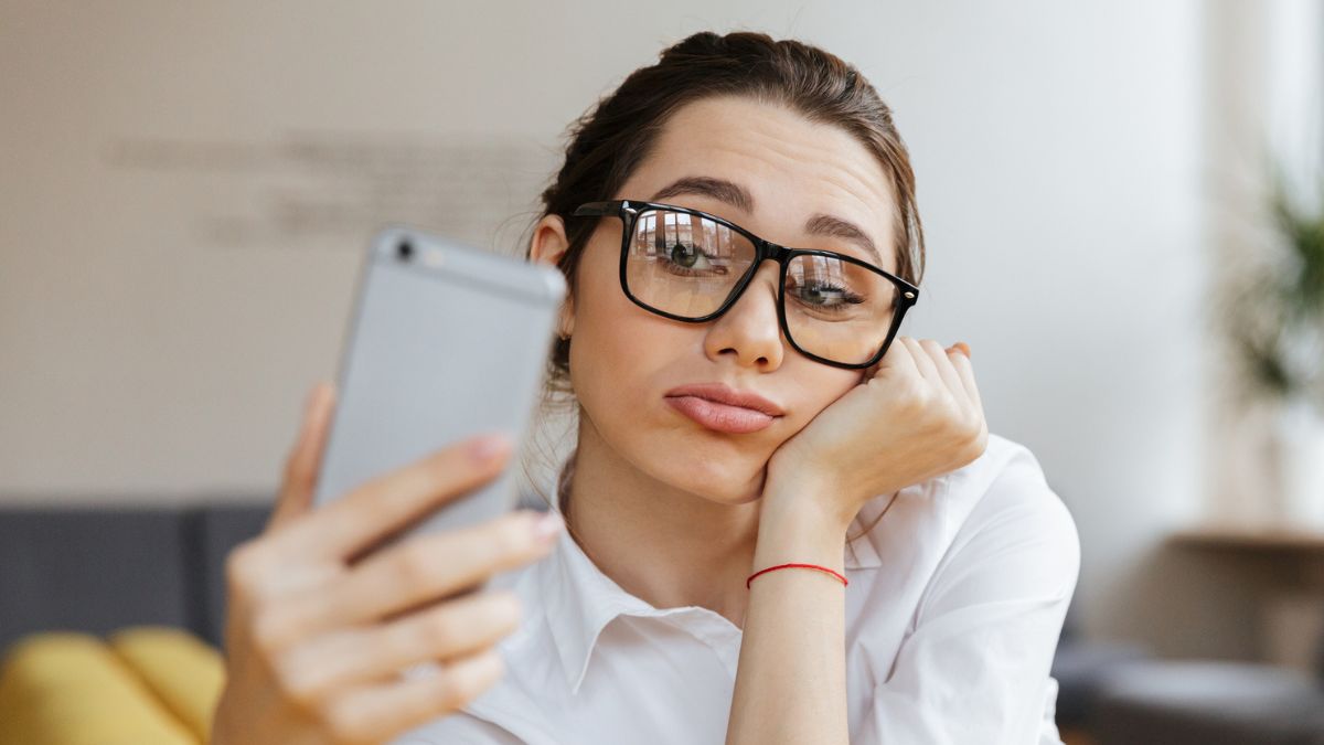 business woman bored with phone
