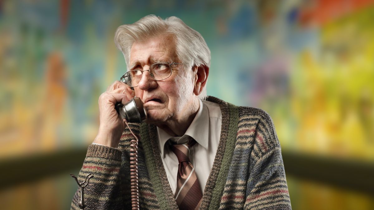 elder man sad on the phone