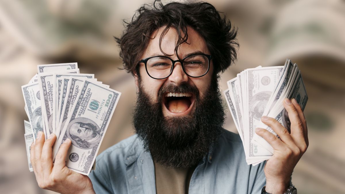 man with beard laughing with money(1)