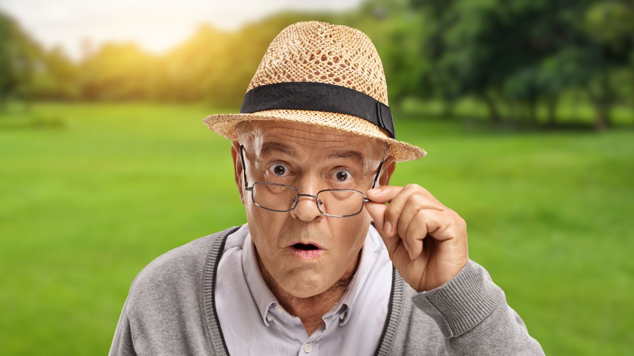 man with glasses in a park