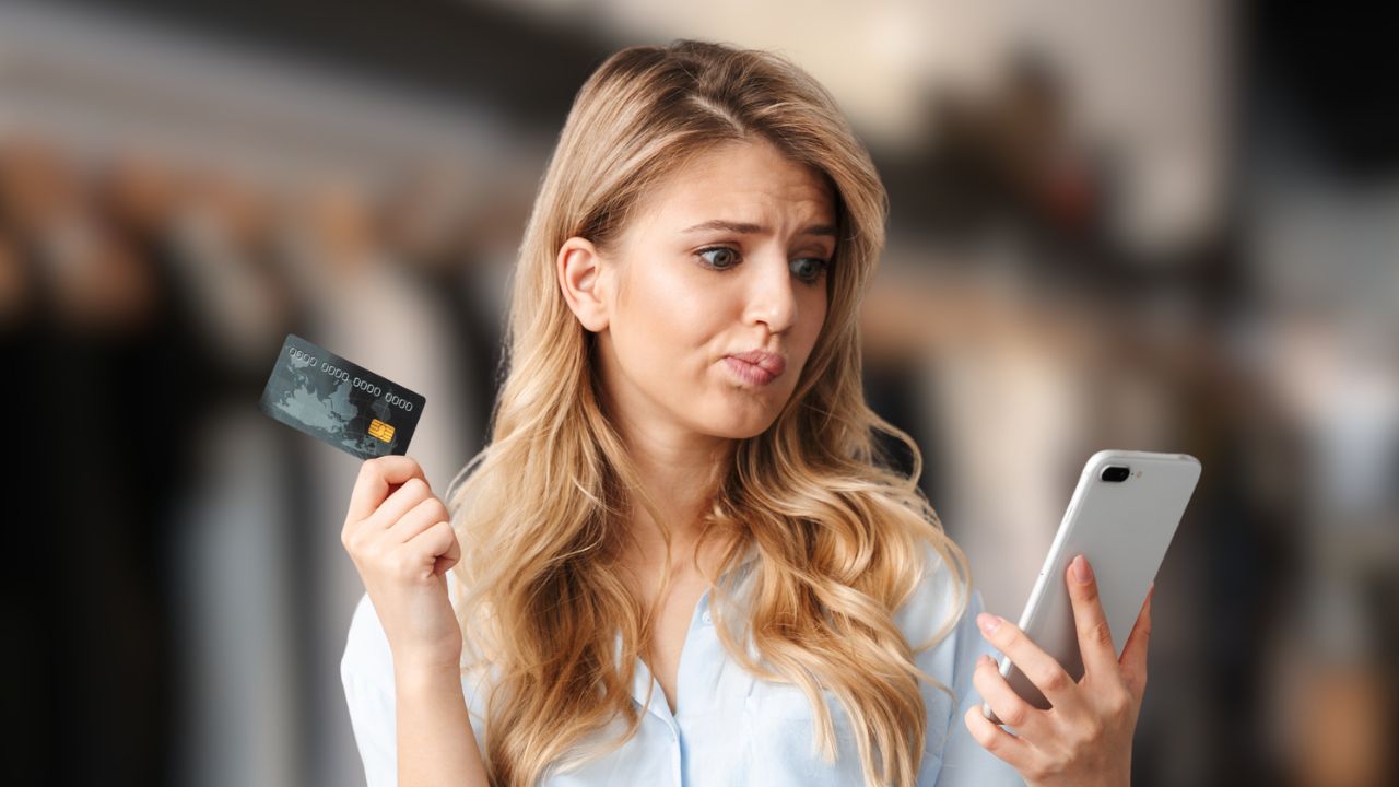 woman with credit card and phone