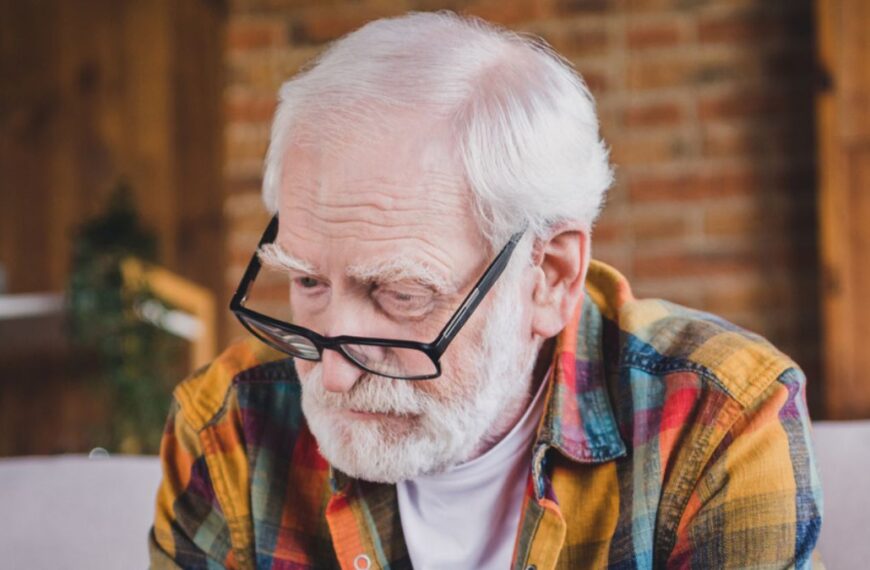elder man sad with glasses
