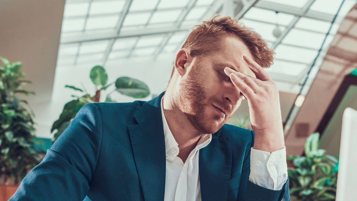 man stressed at the office