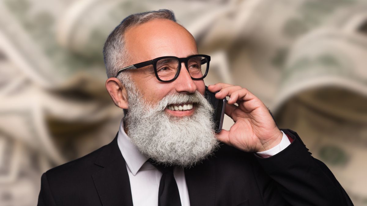 man with beard and glasses and phone