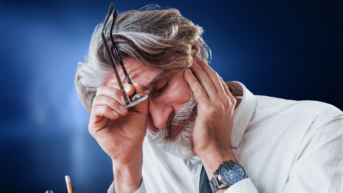 man with beard and glasses stressed out