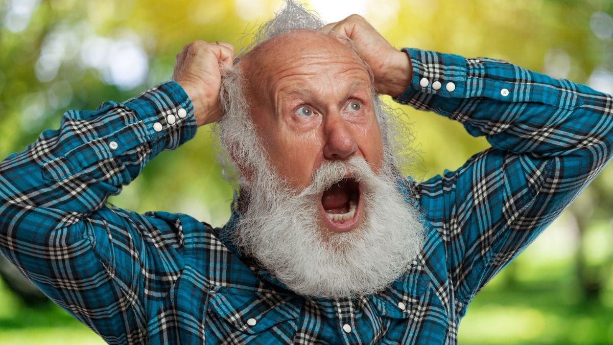 old man beard shouting in park