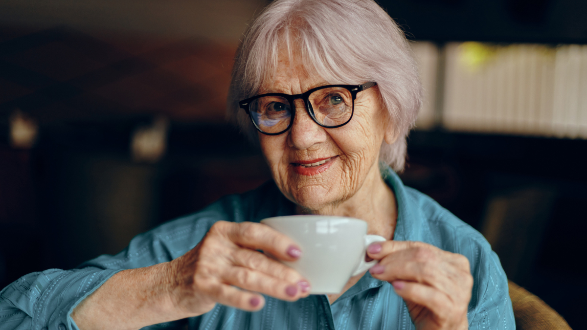senior woman glasses and mug