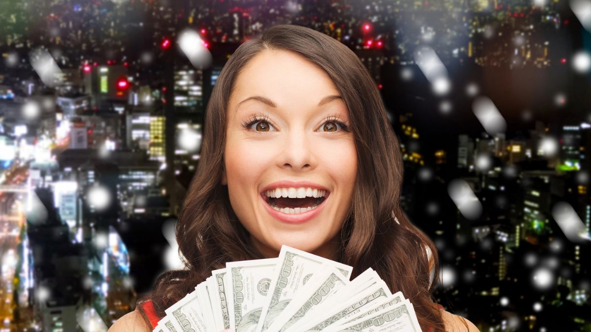woman holding cash in glitter