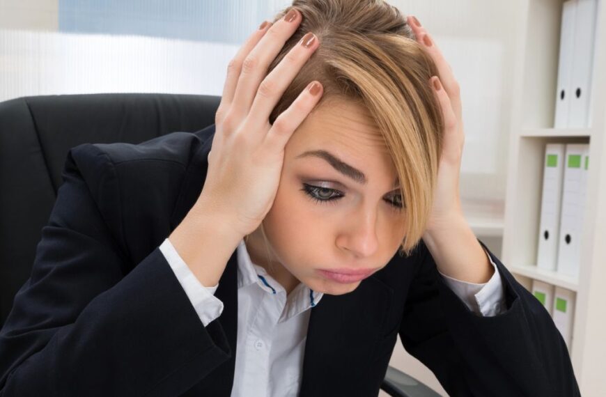 woman stressed over office work on desk