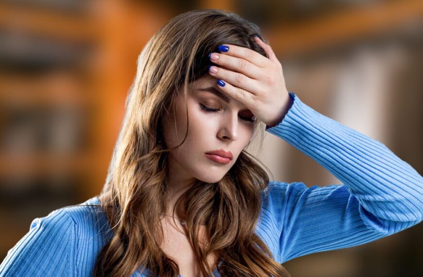 woman stressed with hand on head