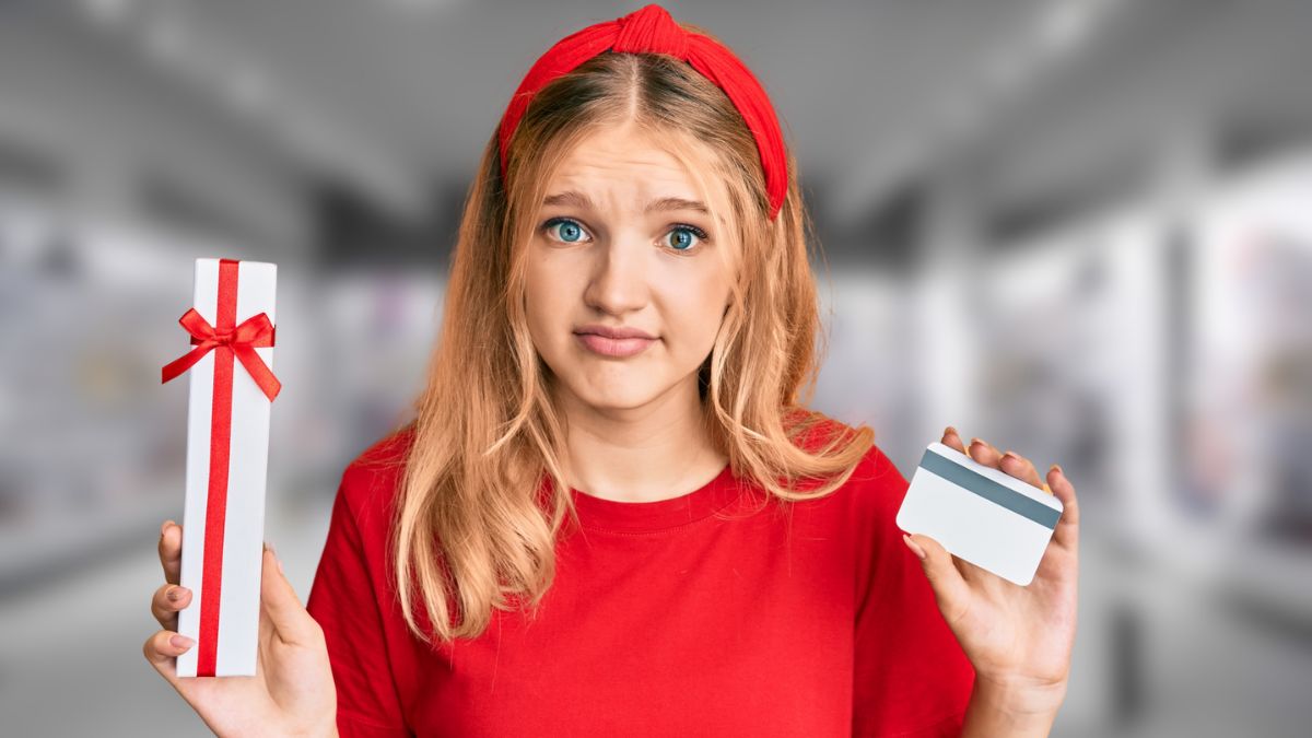woman with credit card and present