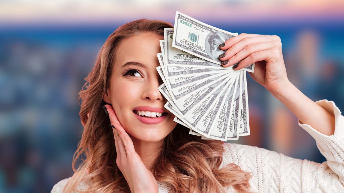 woman with cash in downtown