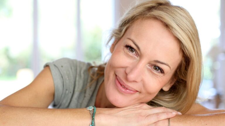 woman smiling resting head down