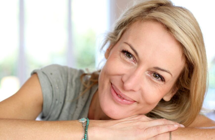 woman smiling resting head down