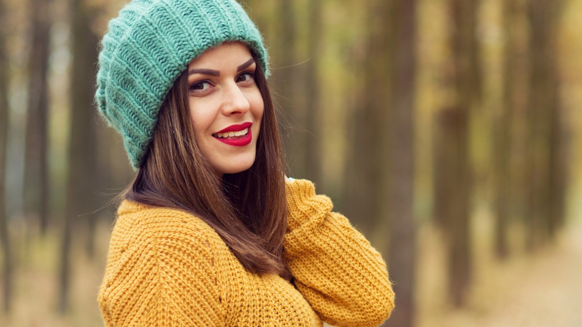 women with red lipstick in yellow sweeter